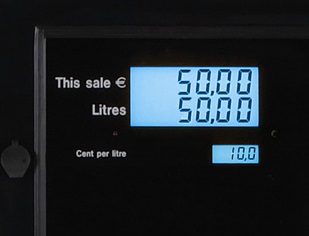A close-up photograph of an LED display on a petrol pump. The display is illuminated, showing information such as fuel prices, volume, or payment options. The image conveys the concept of a digital display used for information and transactional purposes at a petrol station.