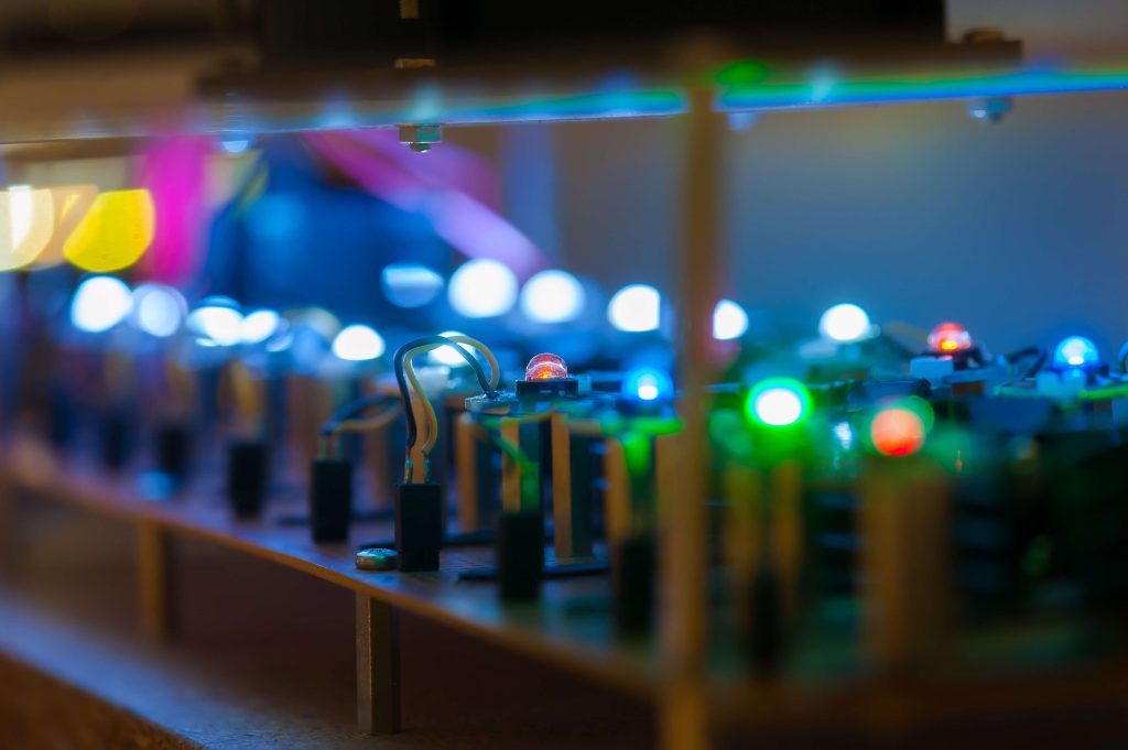 A view of a photometric test laboratory with specialized equipment and setups. The laboratory environment is organized and well-equipped for conducting photometric tests on lighting fixtures or optical components. The image conveys the controlled and technical nature of the testing environment