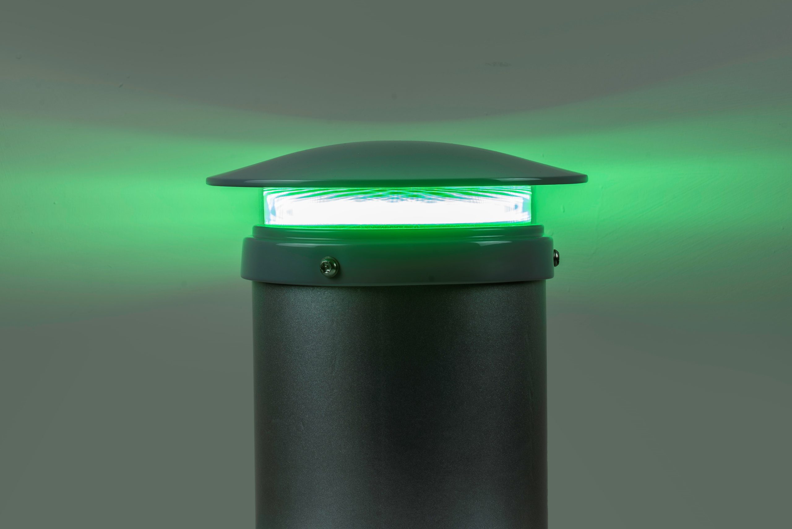 A close-up photograph of a glowing green light. The light emits a vibrant green hue, suggesting a signal or indicator. The image conveys the concept of a green light or signal in a specific context.